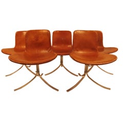 Elegant dining room chairs by Poul Kjaerholm