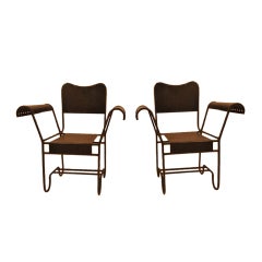 Pair of metal armchairs by Matthieu Mategot