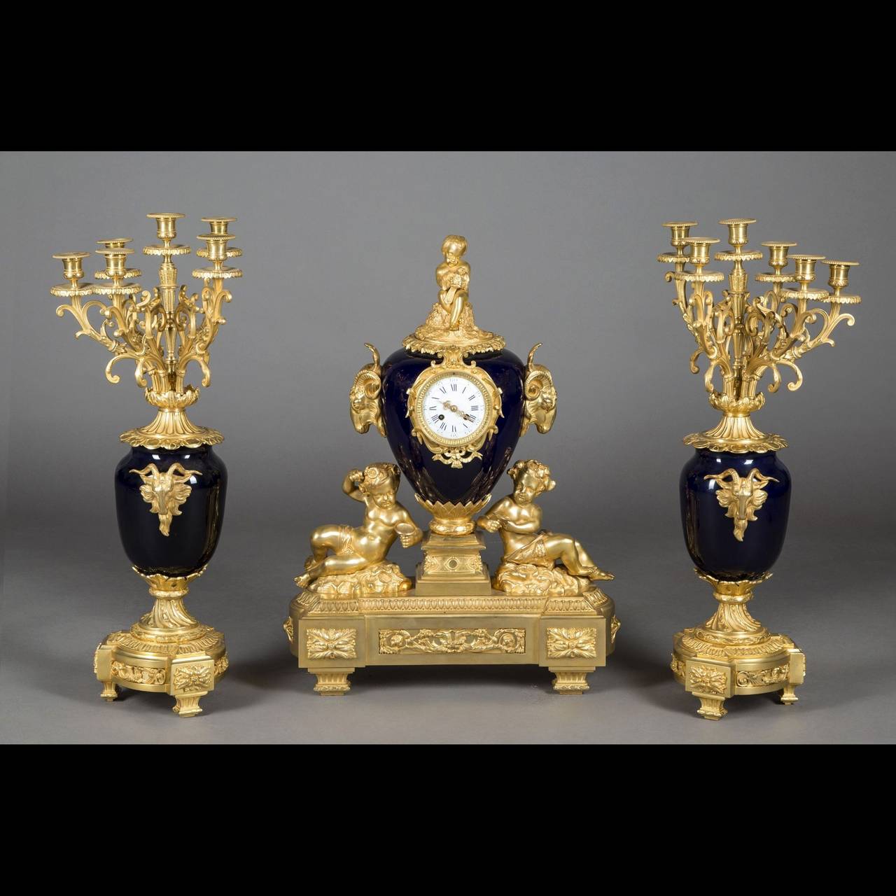 Porcelain and Gilt Bronze Three-Piece Clock Garniture, 19th Century