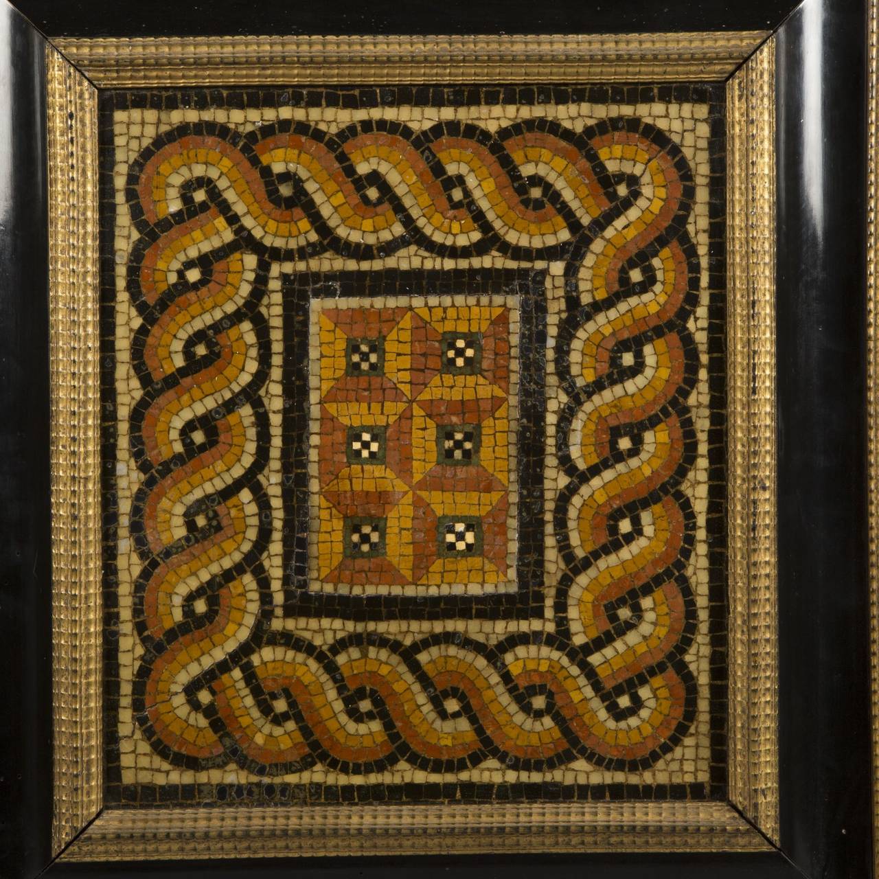 Mosaic with trompe l’œil geometric decoration. Roman Period mosaic within ebonized wood frame with gilt guilloche pattern, 17th Century.

Height: 32 cm, Width: 28 cm, Depth: 2 cm (mosaic)
Height: 54 cm, Width: 50 cm, Depth: 6 cm (with frame)