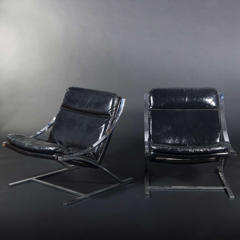 Paul Tuttle (1918-2002), Strassle International Editor.

Pair of “Zeta”model chairs.  Structure and support composed of thick chromed steel cantilever designed as inverted “Z”. Bent wood backrest and seat upholstered with satin-finish black