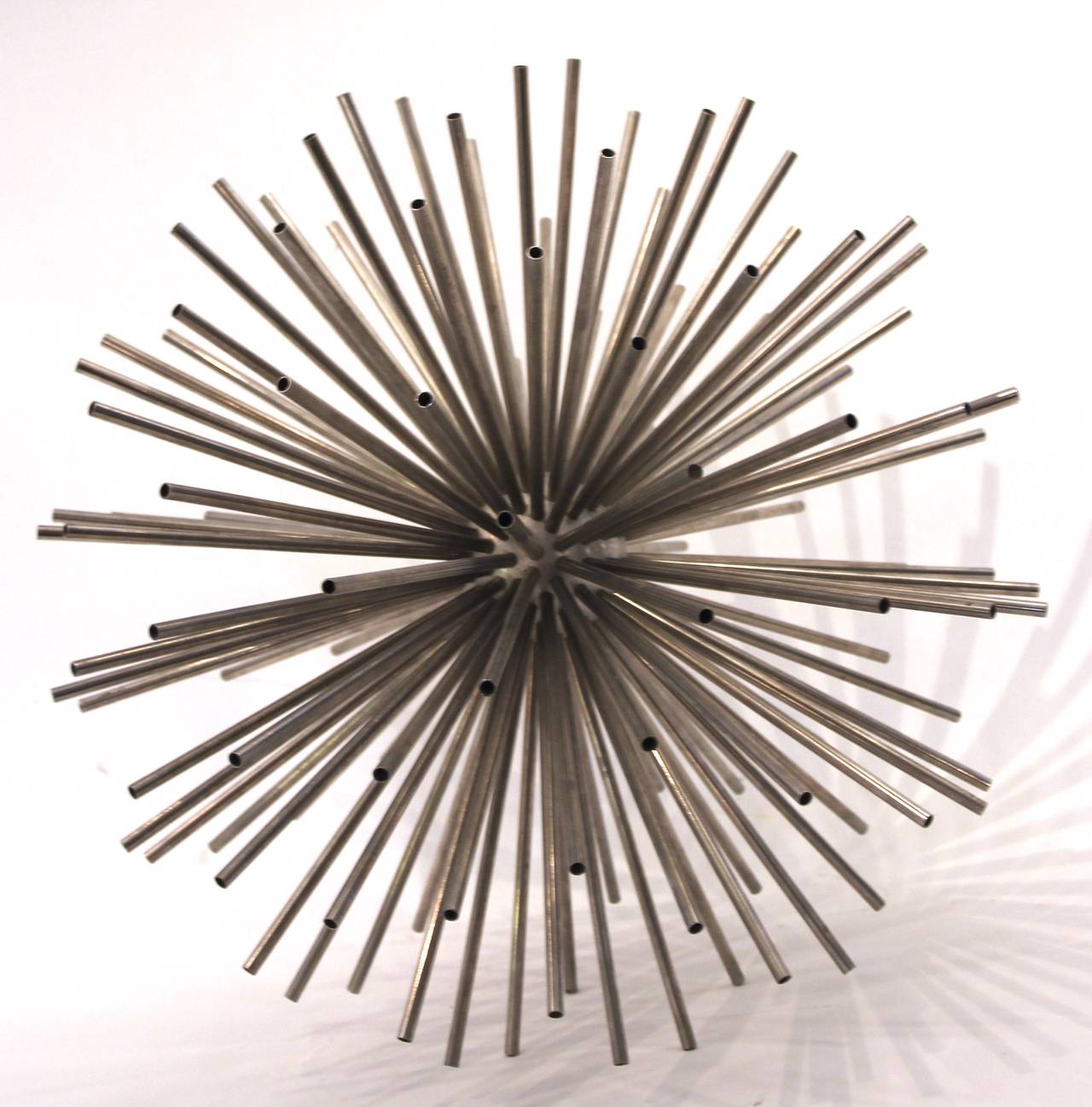 Curtis Jere,  Sputnik sculpture, 
chrome plate steel with steel tubes raditing in all directions,
circa 1970, USA.
Height: 70 cm, diameter: 65 cm.