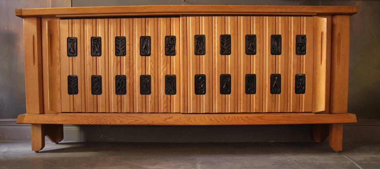 Sideboard by Guillerme and Chambron,
Polished oak,
Ceramic by Boleslaw Danikowski,
Edition 