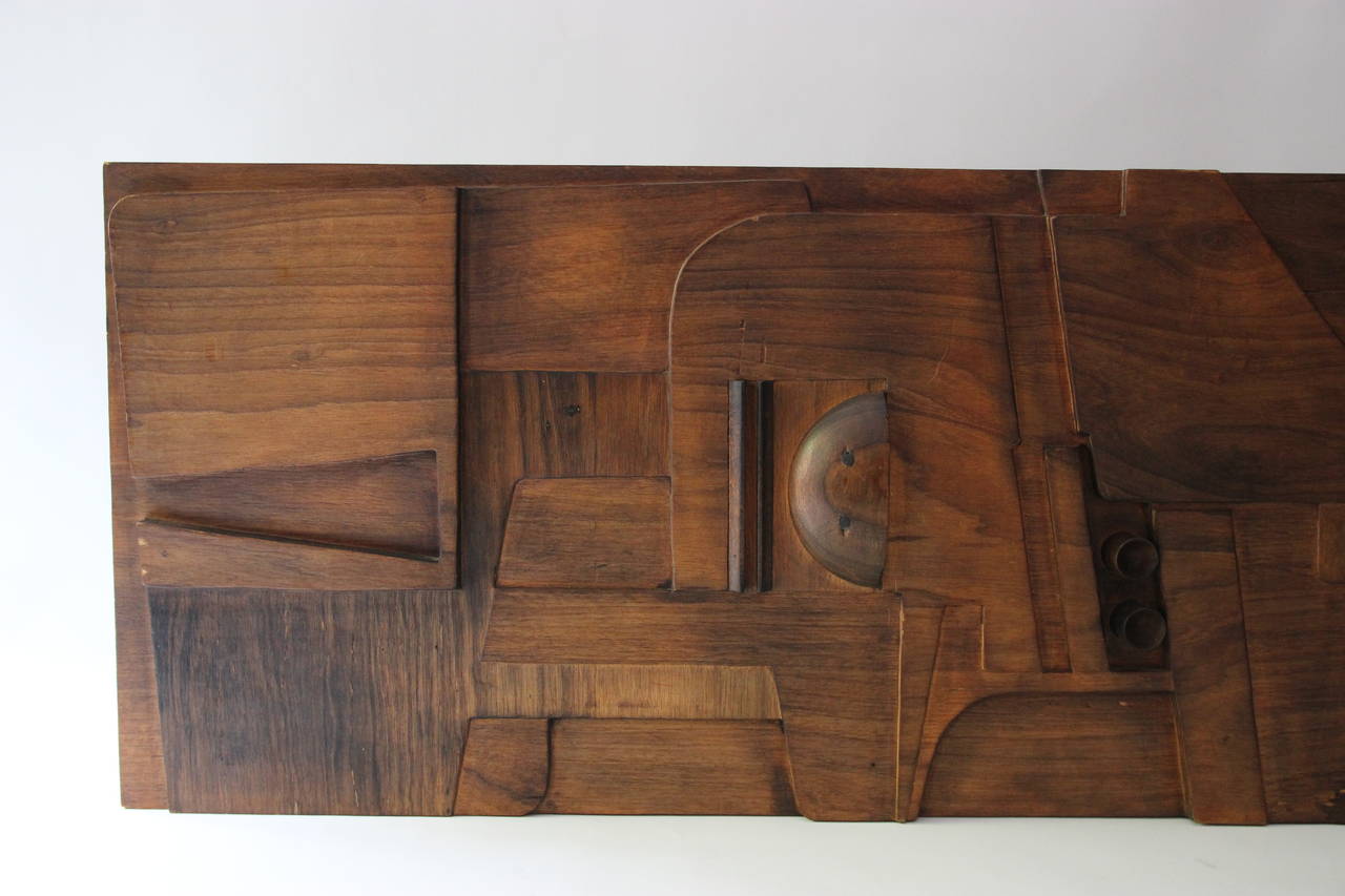 Nerone and Patuzzi, NP2 Group, sculpted wood. 
Wood panel pirographed and worked by hand,
Italy, circa 1970.
Measures: Height: 60 cm, length: 173 cm, depth: 6 cm.