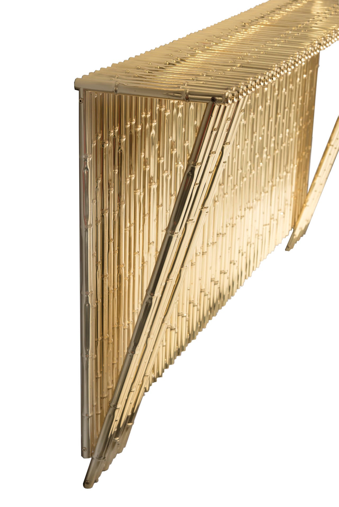 Ferruccio Laviani,
console,
gold-plated brass bamboo, unique piece,
circa 2010, Italy.
Measure: Height: 1 m, width: 187 cm, depth: 33 cm.

Provenance: Famous restaurant 
