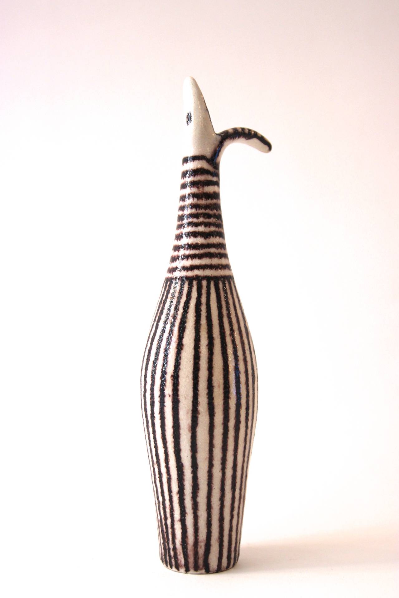 Guido Gambone (1909-1969), Bottle, 
Glazed earthenware,
black and white stripes decor,
Signed and stamped: Gambone under the base, 
Italy, 1960.

Measures: Height 24 cm, diameter 4 cm.

Guido Gambone (1909 – 1969) is one of the most important and