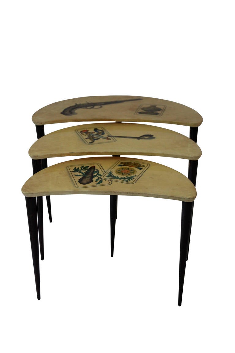 Aldo Tura, set of three gigogne tables, Italy, circa 1950, Ggigogne tables entirely covered in varnished parchment and standing on four slender mahogany feet.

Measures the largest: Height: 40 cm, length: 60 cm, width 33 cm, 
Measures of the