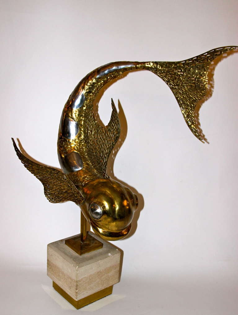Jacques Duval-Brasseur (1934-2021), Fish Sculpture, 
Gilt bronze and stone base, signed,
Unique piece, circa 1973,
Produced and signed/ D.Brasseur.

Measures: Height 90 cm, marble cube: width 20 cm, depth 20 cm.

He was born in 1934 in Tours where