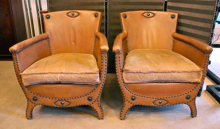 A pair of armchairs in original leather (light brown) designed in 1930 and edited by Boet in Gothenburg. Worn leather on the armrests.
