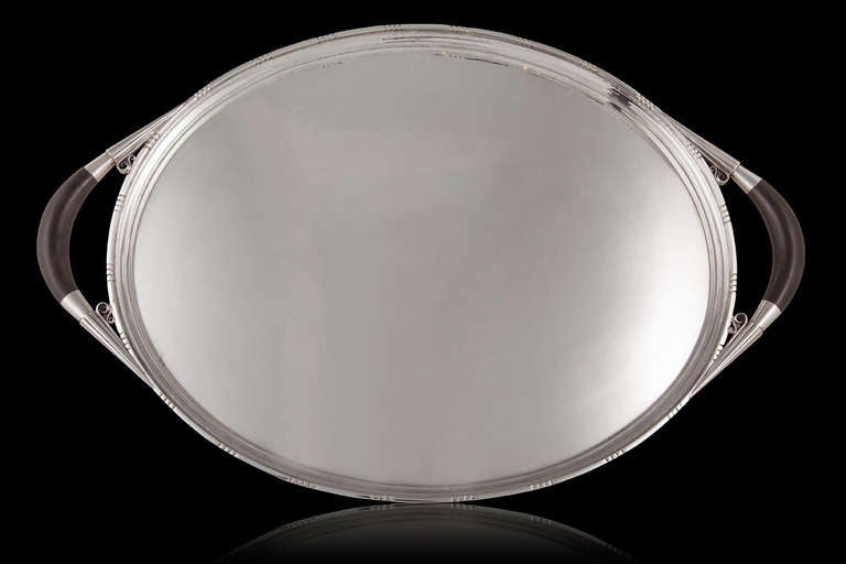 Georg Jensen sterling silver Cosmos tray with ebony handles, design 251C by Johan Rohde. This tray matches the Cosmos #45 tea/coffee service, also designed by Johan Rohde.
Measures 20 1/4