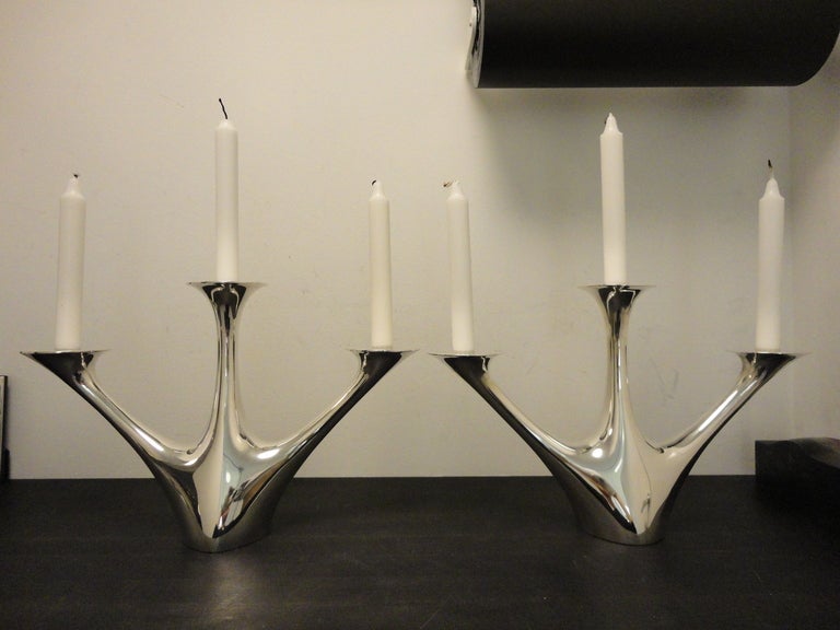 A pair of Large Georg Jensen Henning Koppel Candelabra 1075
This is a pair of large monumental three armed candelabra in sterling silver design #1075 by Henning Koppel.
This item is new.

Please note that VAT will be added for customer in the EU.