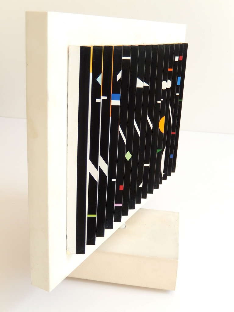 A double-sided Kinetic sculpture by the Israeli artist Yaacov Agam (b.1928), 
A leading member of the Kinetic and Op Art movements. In 1951 Agam moved to Paris and in 1955 his work was exhibited alongside the work of Alexander Calder and Jean