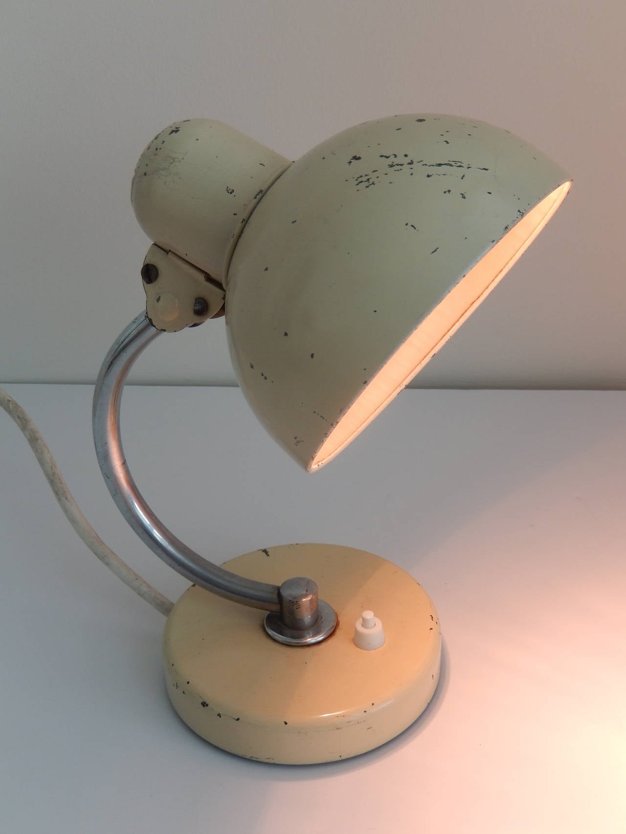An enameled metal and chrome table lamp, 