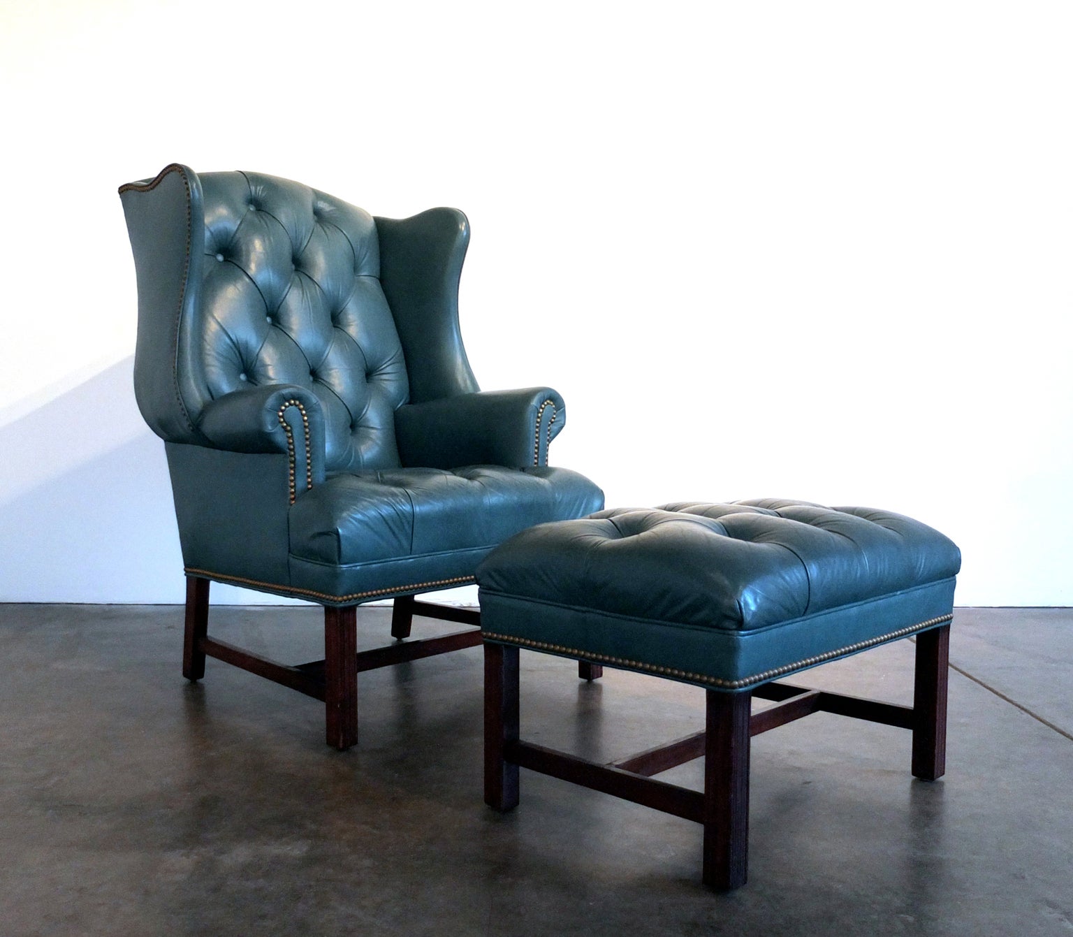 Tufted Leather Wingback Chair and Ottoman by Hancock & Moore