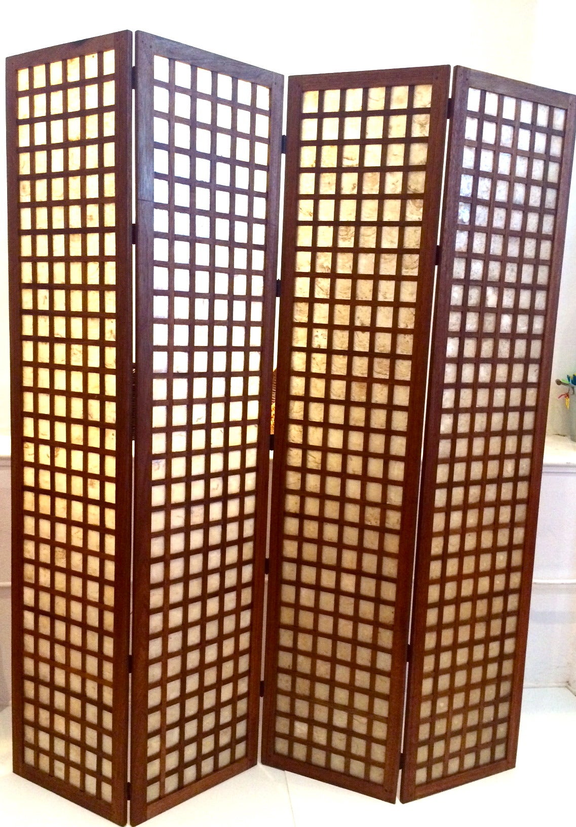 Rare tall room divider or folding screen in solid mahogany with capiz shell inserts, circa 1950s, four panels each panel its 18 1/4