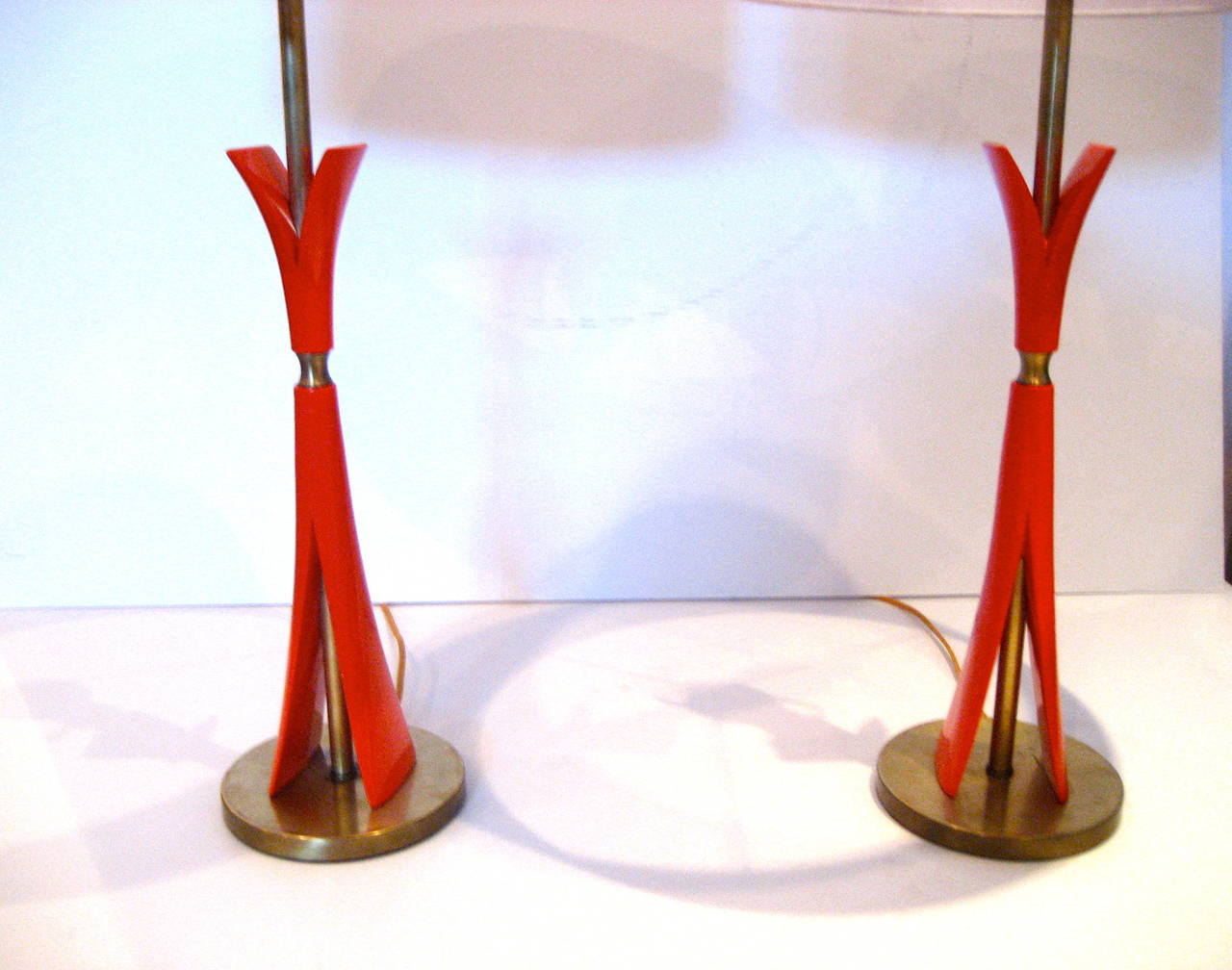 Great set of table lamps circa 1940s, solid metal bases with polished brass accents, these set of lamps have been rewired and restored the orange cast metal has been sandblasted and powder coated the brass fittings have been polished and rewired