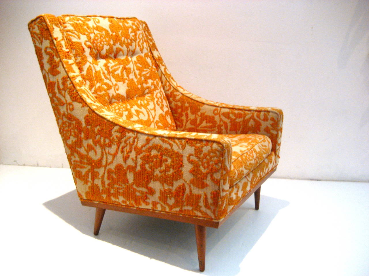 Great lines and original flower fabric on this tall back lounge chair, designed by Milo Baughman for James INC, distributed by Thayer Coggin, the fabric its so striking and beautiful that we decided to sell it as/is, but it can use new upholstery