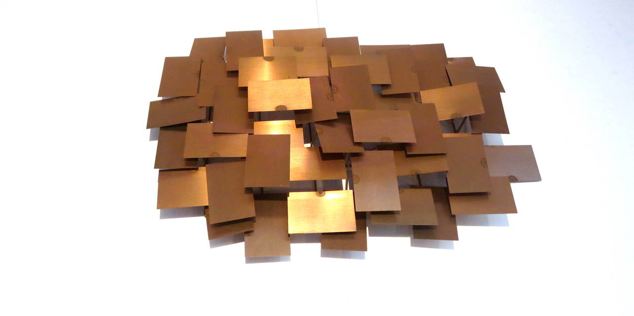 Solid copper welded laminate squares wall sculpture in the style of Curtis Jere, circa 1970s, unsigned.