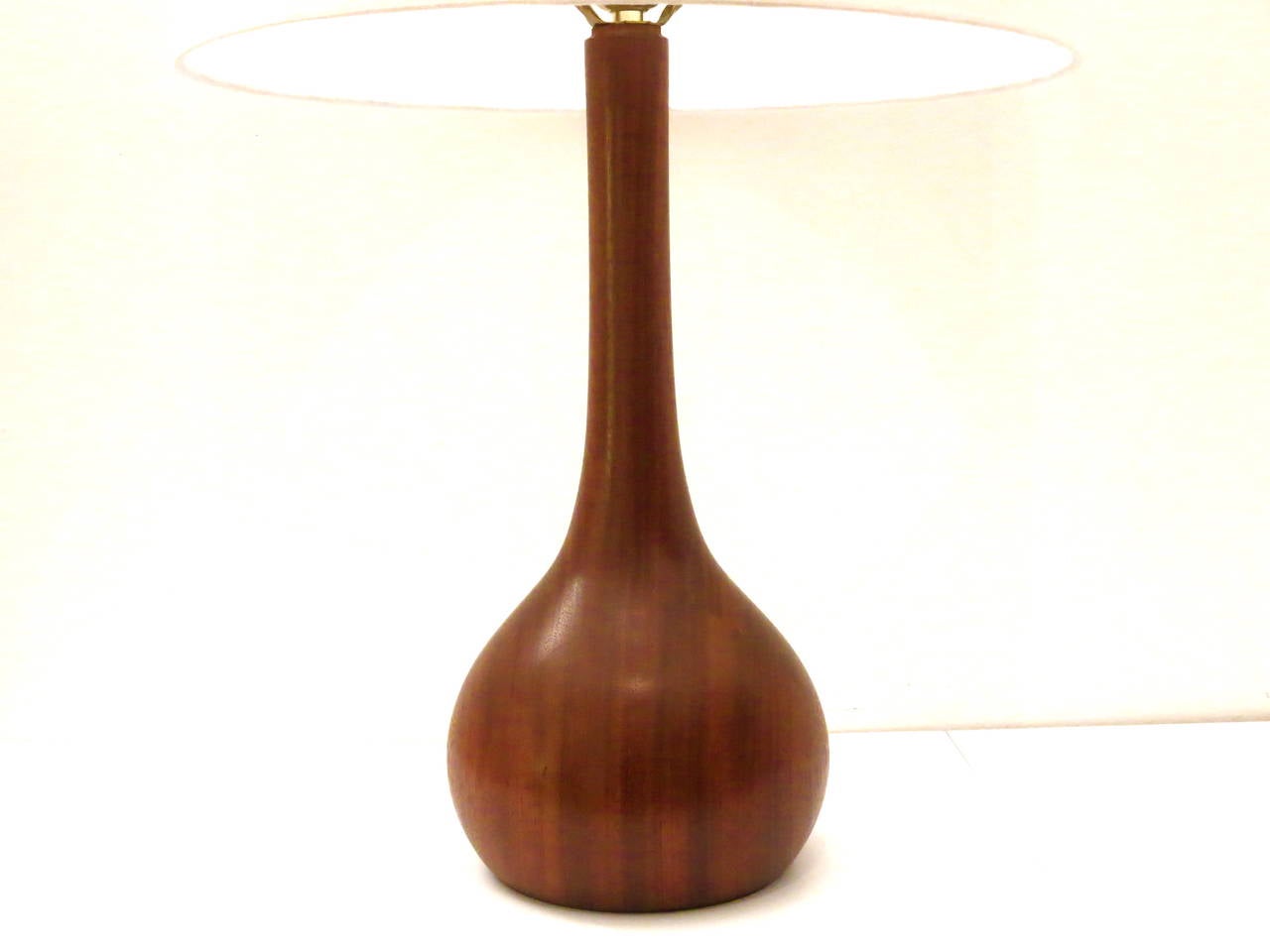 Beautiful single solid teak table lamp, Bulbous sculptural base, rewired and refinished great condition with new lamp shade. The lamp its 24