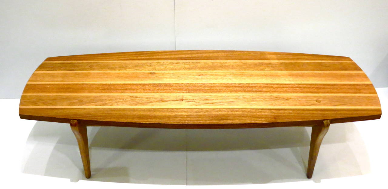 Beautiful and rare surfboard coffee table in multimix of woods, mahogany, and birch designed by John Keal for Brown Saltman, circa 1950s freshly refinished solid and sturdy, 1