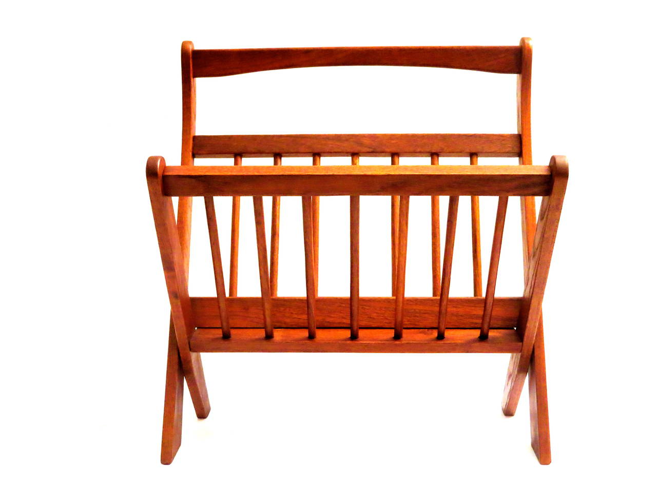 Simple elegant solid teak folding magazine rack , no nails used on this great craftsmanship piece , circa 1950s , refinished sanded and oiled in great condition. folds for easy storage.