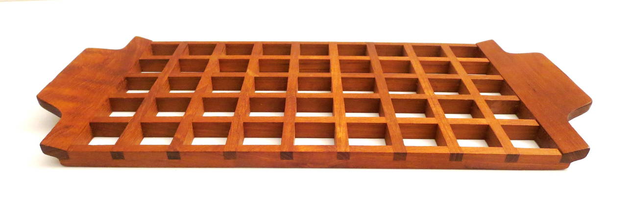 Simple elegant solid teak tray designed by Anri Form, Made in Italy circa 1950s, incredible craftsmanship and detail on this solid teak tray with handles, a hard to find and rare piece, with its brass medal in the back as shown and great condition.
