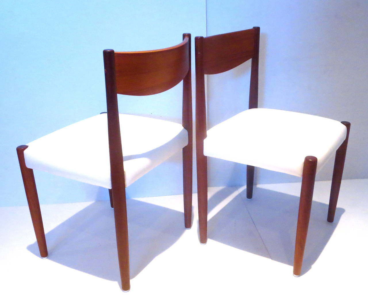 Great set of 4 chairs designed by Poul Volther for Frem Rojle circa 1950s in teak , very nice and clean condition , the chairs are recover in white naugahyde , cleaned and oiled solid and sturdy.