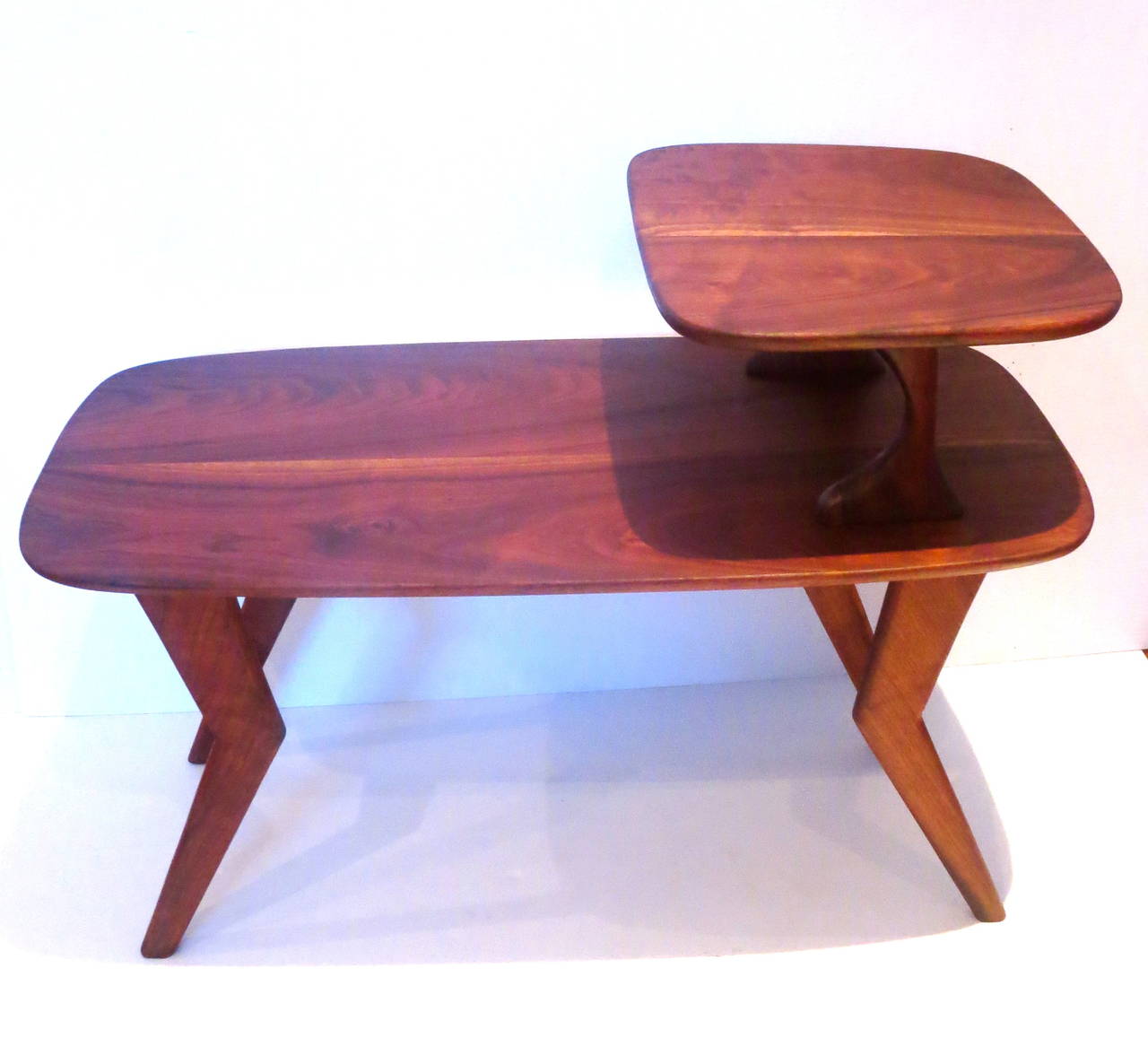 Beautiful pair of step end tables in solid walnut freshly refinish, great sculpted legs and beveled edge tops, solid and sturdy beautiful grain, perfect to place in between two chairs buyer has the choice to buy one or two, circa 1950s unknown