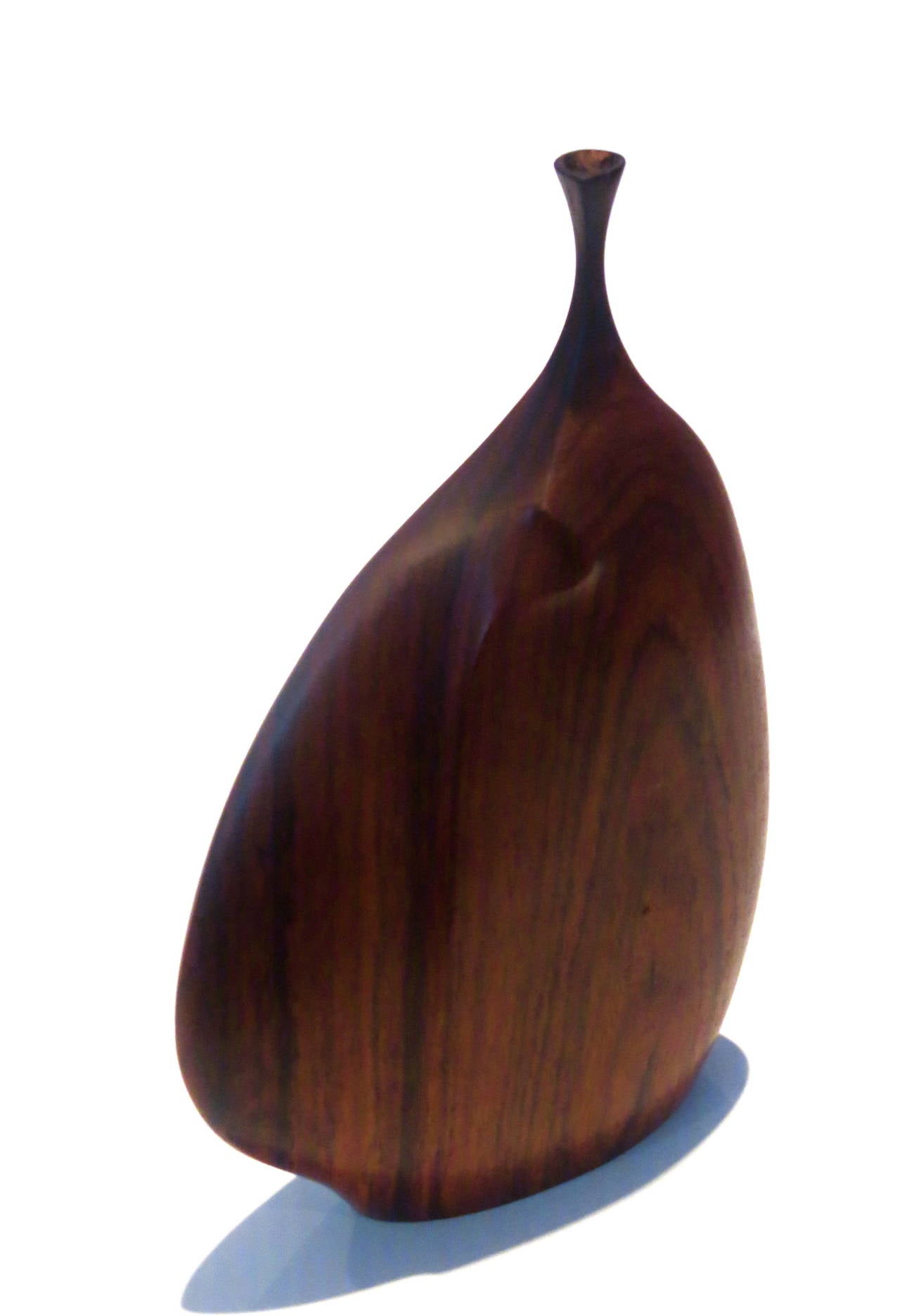 A beautiful wood vase done by well-known artist Doug Ayers, circa 1960s signed at the bottom, I believe its rosewood, the condition its great except there was a professional repair on the neck, invisible to the eye, but needs to be mentioned, simple