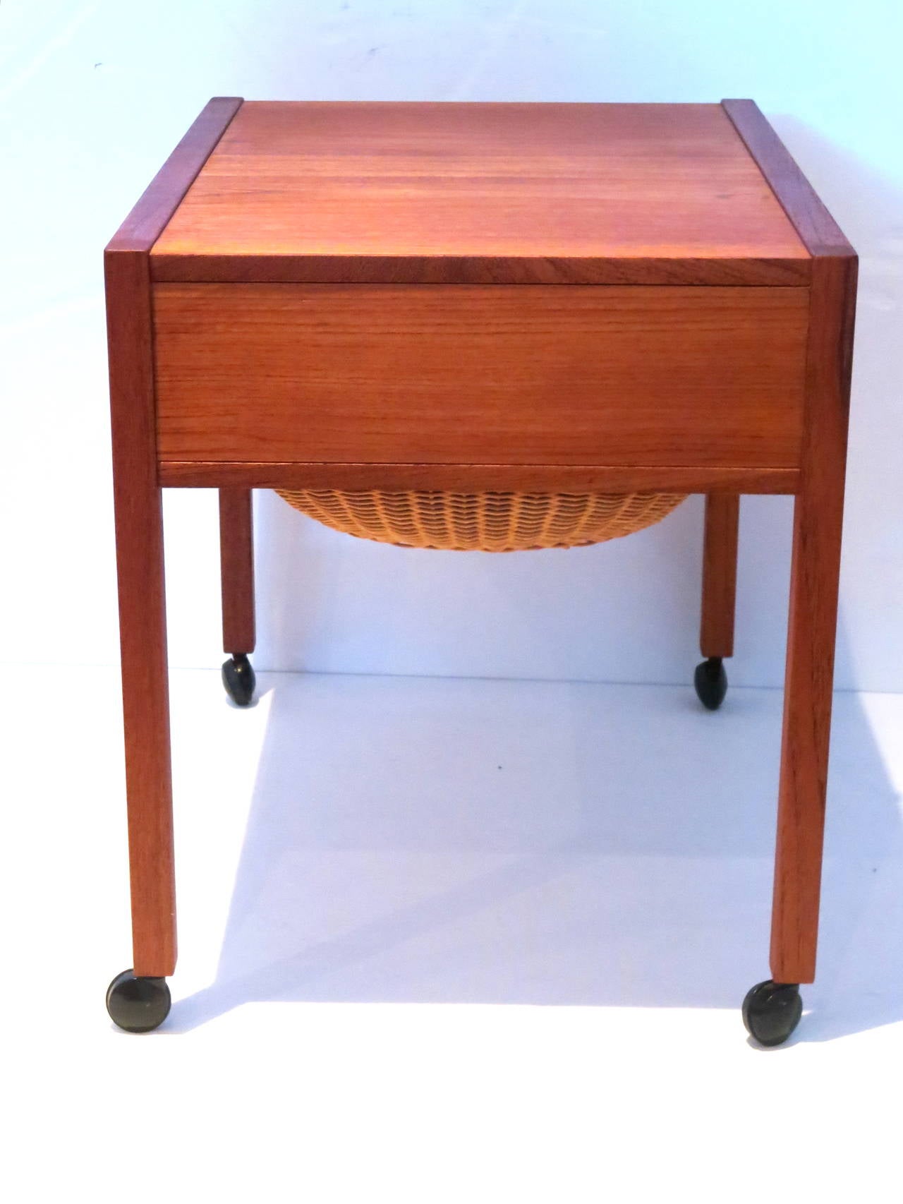 A very rare sewing table by Arne Wahl Iversen, in solid teak made in Denmark refinished very nice condition. Great craftsmanship.