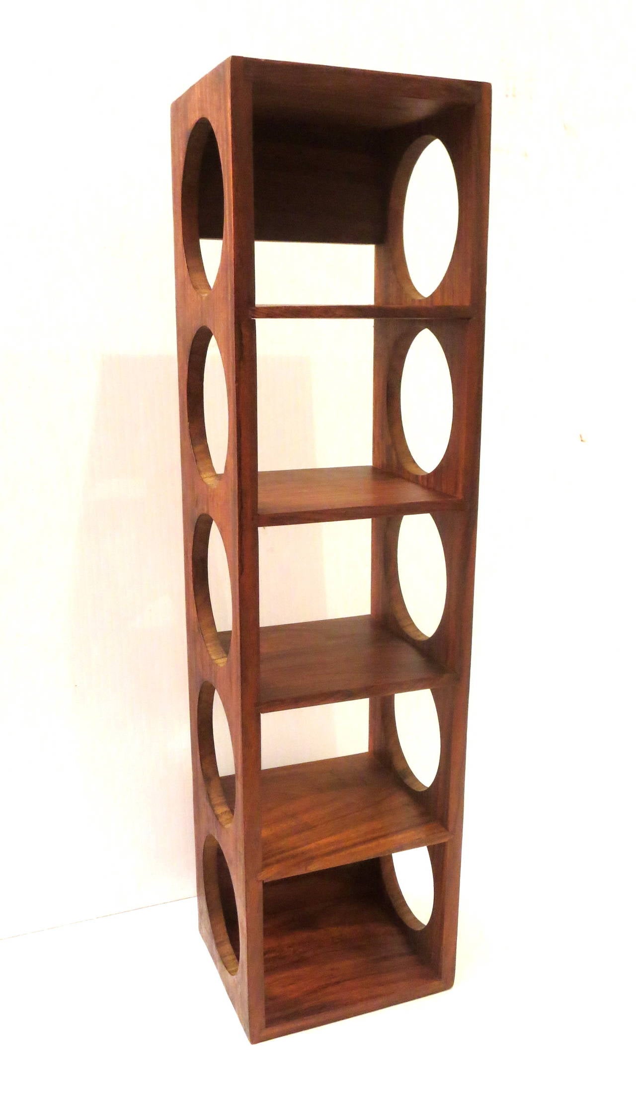 A rare five bottle capacity, solid rosewood wine rack easy to install great condition.