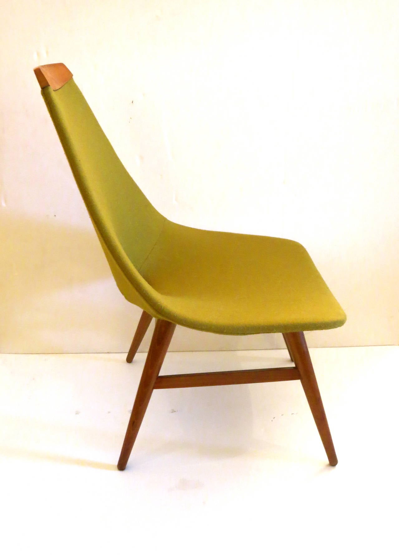 A very rare one of a kind,petite lounge low chair , I belive its American made with walnut base frame and light walnut accent top, circa 1950s all in original lime green fabric , good condition with a couple of light stains , as shown but overall