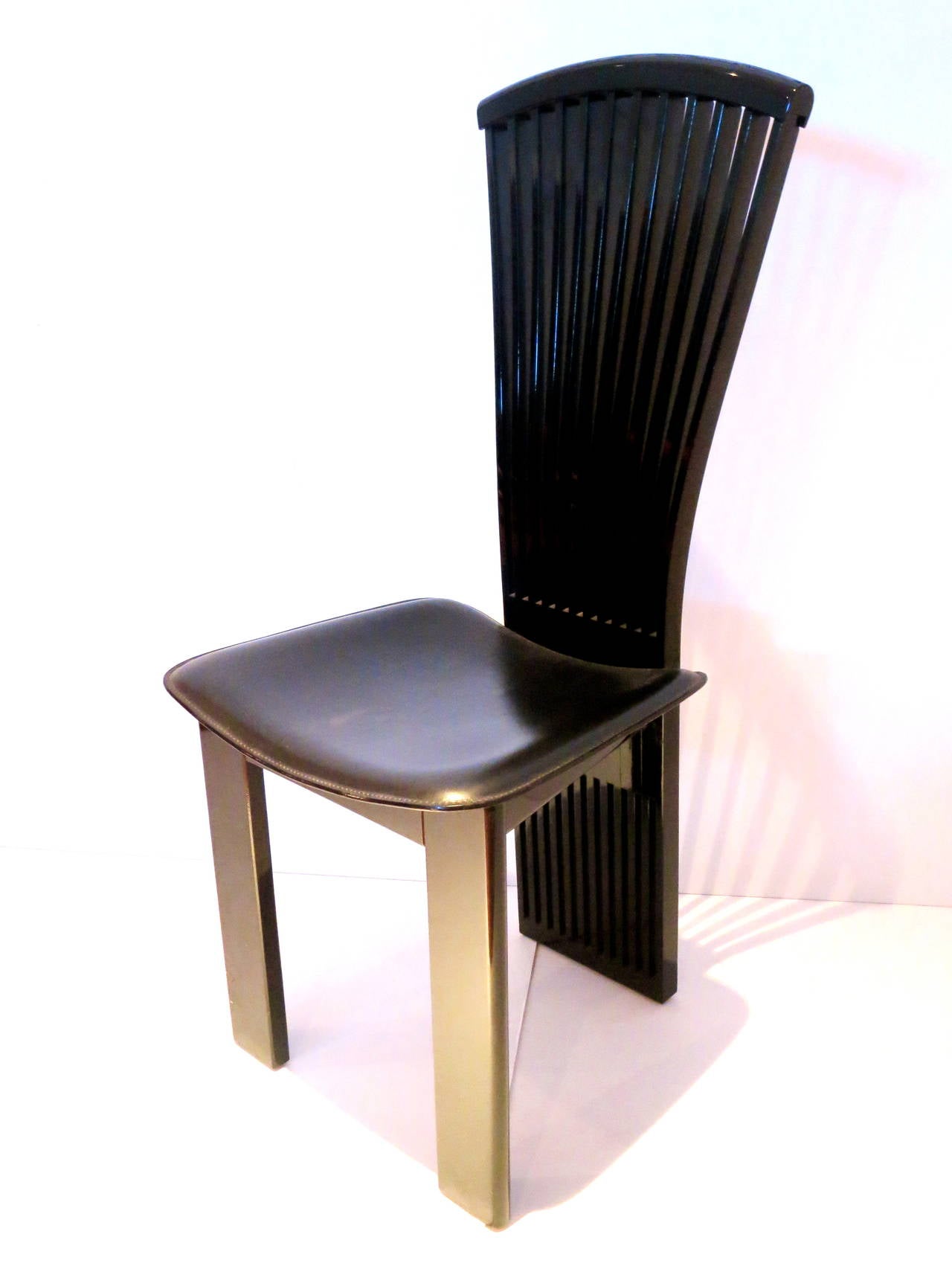Set of 4 tall back Italian chairs by Pietro Costantini , circa 1990s in black lacquer glossy finish and hand stiched black leather seat , solid and sturdy elegant chairs , buyer has the choice to buy 1,2,3 or 4 , stamped Made in Italy by Pietro