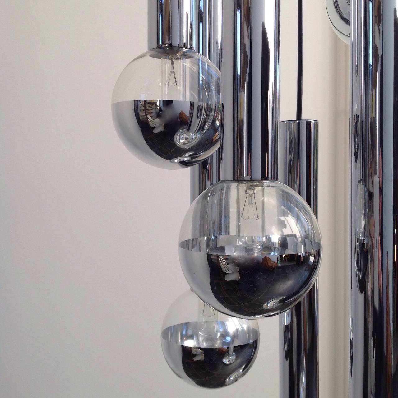 Large cascade lighting made by Staff Leuchten (Germany), design Motoko Ishii.
This sophisticated hanging lamp gives a beautiful light effect.
Ceiling lamp with six chromed metal tubes from three different heights with hand blown glass mirror balls