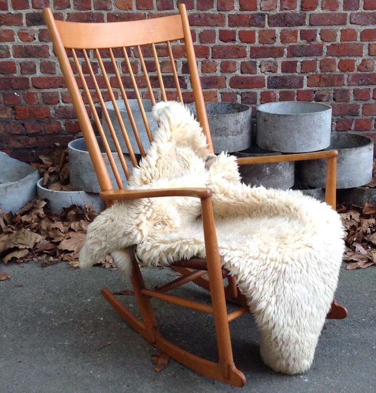 This is a very early Hans Wegner J16 Rocking chair produced by FDB Mobler in Denmark 3-1-1964 (impressed in wood underneath the arm).

The chair still has it's original Danish cord woven seat and is in a very good vintage condition.