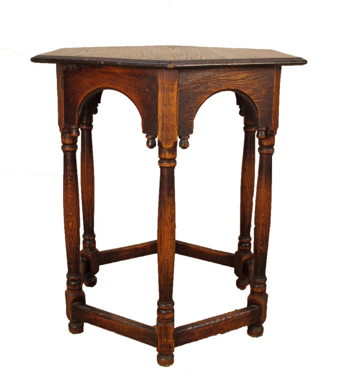 Antique Hexagonal Revival Oak Table, American. Early 1900s. Beautiful patina on the wood. Great size for a variety of purposes...as a side table in a bedroom or center table in an entry.

Courtesy to the trade
