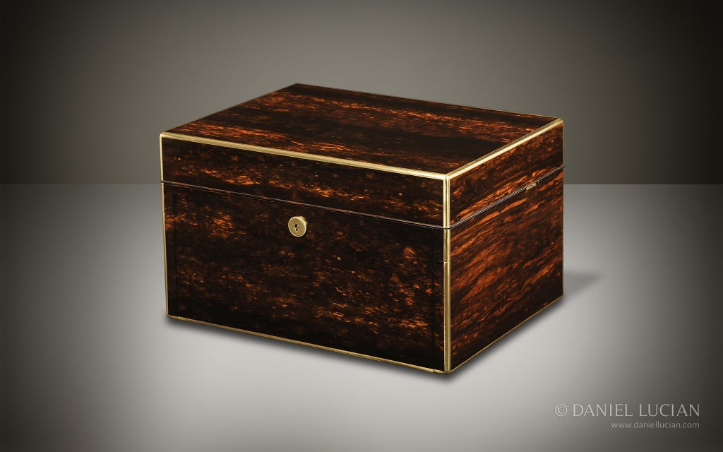 This very special box, veneered in Coromandel, edged with brass and with its rare custom design Bramah lock, dates from the 1870's. It is the creation of George Betjemann, a class leading box maker and innovator of some of the finest and most