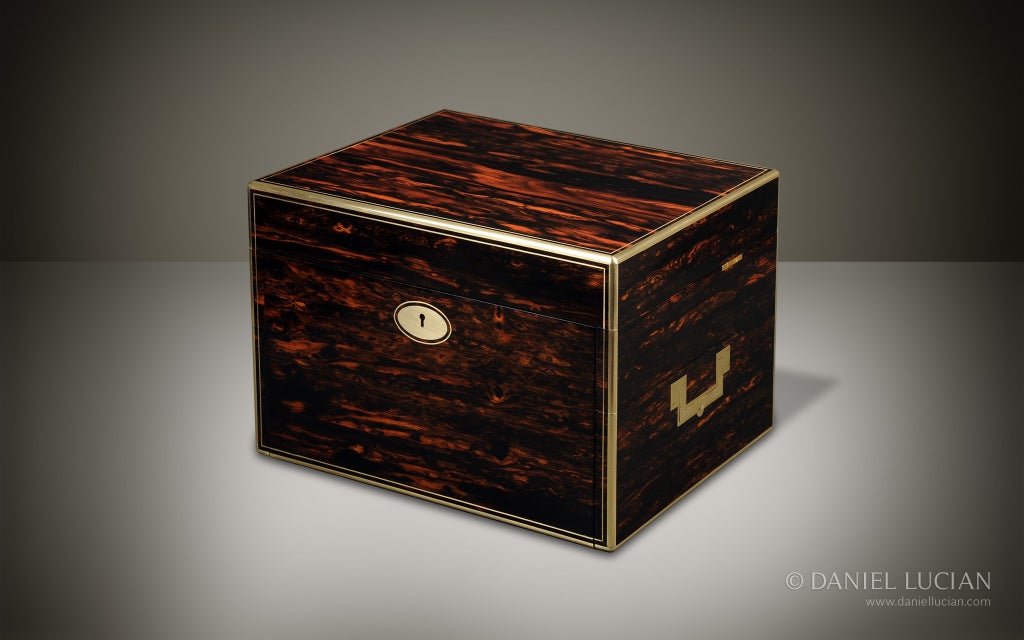 This stylish coromandel box was originally manufactured and retailed in the late 1880s by the very well respected London maker and jeweler, C F Hancock. The vibrant wood grain, brass edging, flush brass handles, along with its impressive size, make