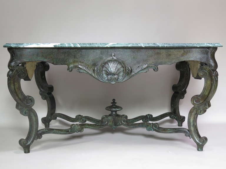 Impressive Louis XV centre table of generous proportions. The elaborately carved walnut base is 18th century. The top was replaced, circa 1900s with a serpentine top of Vert des Alpes marble (green with white veins - the quarry, situated in the