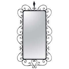 Grand miroir biseauté dans un cadre en fer forgé - France:: années 1940