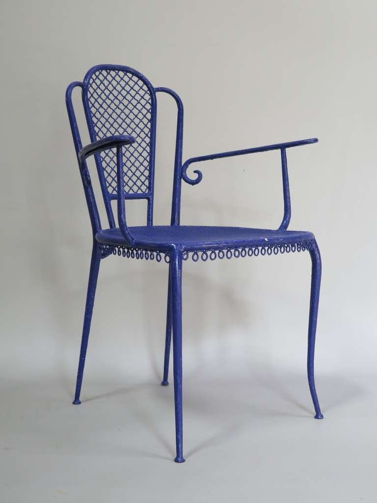A lovely wrought-iron set comprised of three armchairs and a round table, painted a deep-blue colour.

Dimensions below are for the chairs. The table measures (in centimeters):

Height: 72
Diameter: 80