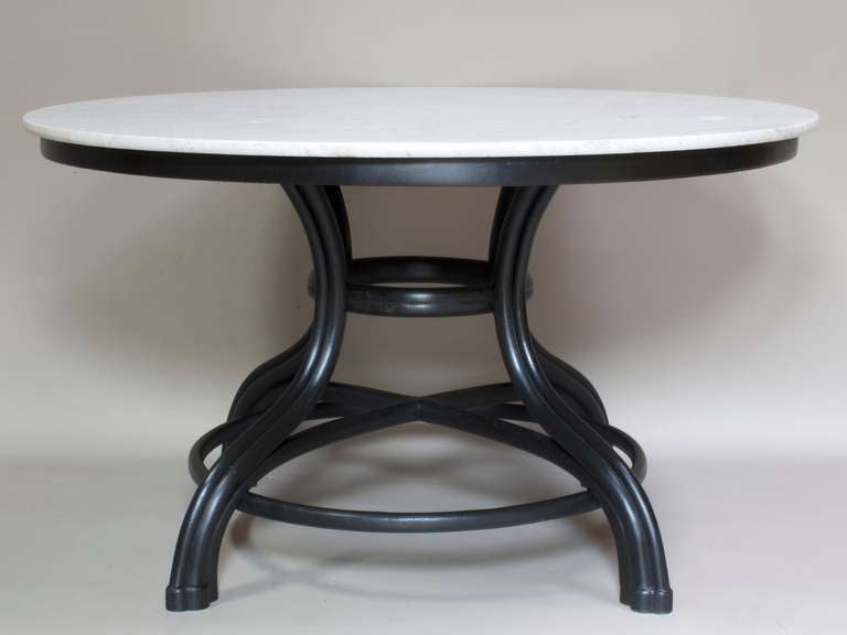 Large round dining or center table with an elegant bentwood base painted black and original marle top (white veined with grey).<br />
<br />
In the style of Thonet.<br />
<br />
Still retains original paper label on both the base and the marble: