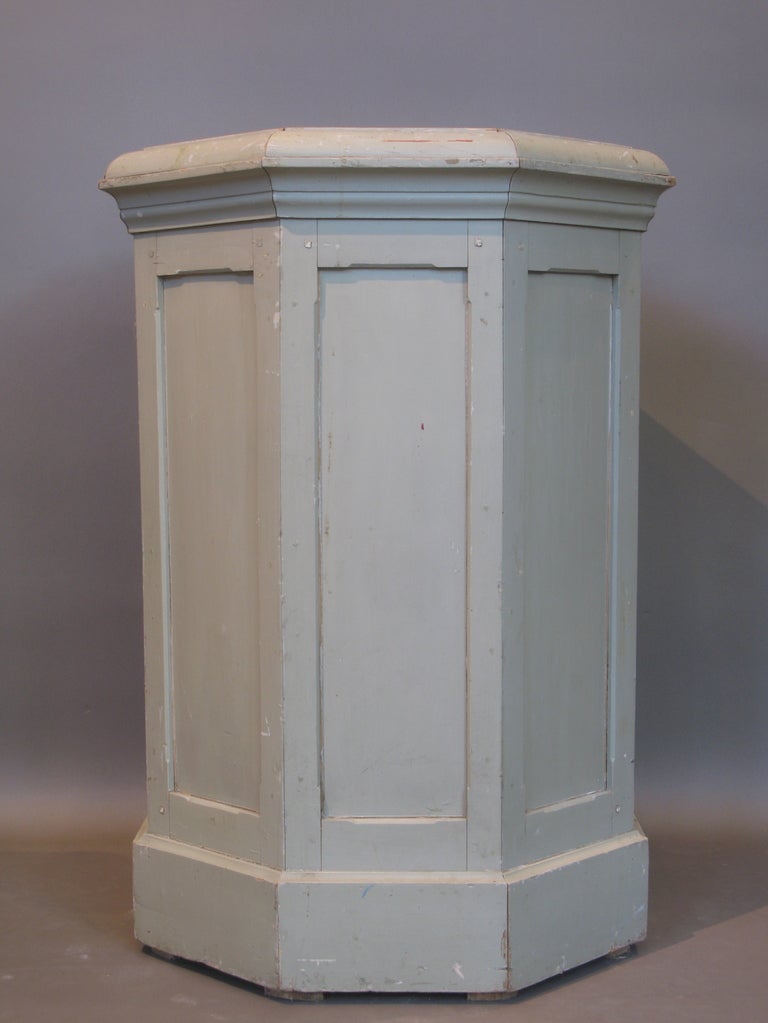 A classic column planter with original painted wood panel structure and original zinc vessel inside.