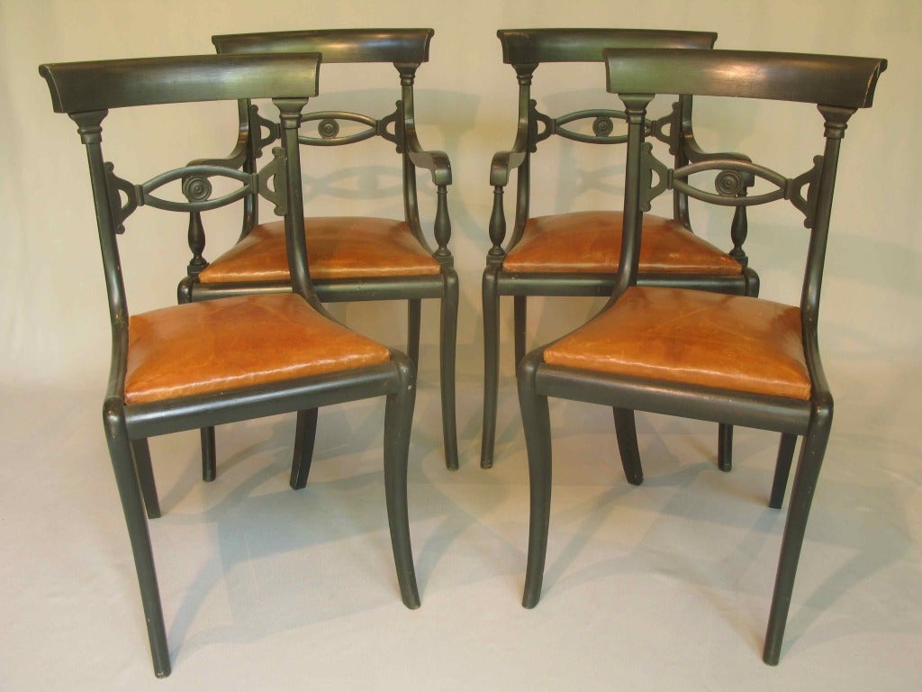 Two chairs and two armchairs. Original cognac-coloured leather seats with fine gold embossed frieze.

Dimensions provided below are for the armchairs. The chairs measure (in centimeters):

Height: 88
Width: 46
Depth: 46
Seat height: 46