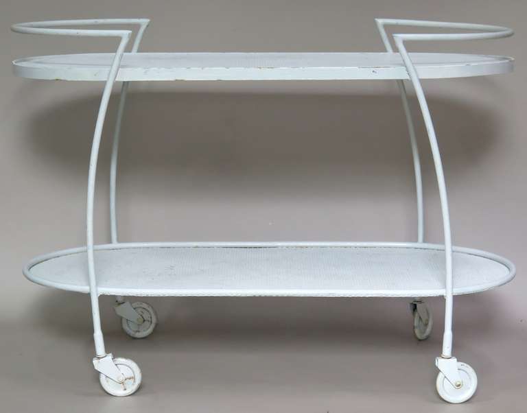 Funky wrought iron bar cart on casters, in the style of Mathieu Matégot. Two oblong-shaped tiers.