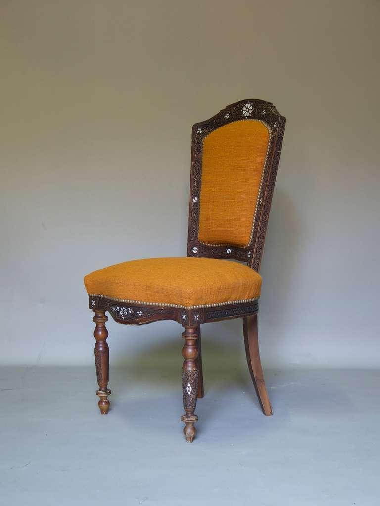 Beautifully carved side chair, with mother-of-pearl inlays, newly upholstered in vintage wool.
