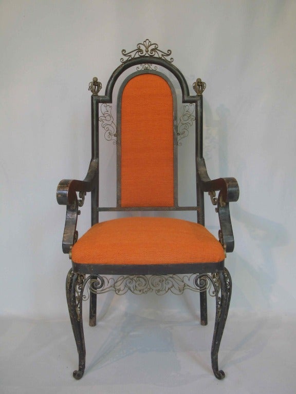 Amazing neo-baroque hand-crafted armchair. Hollow metal structure with original black finish, and adorned with scrolling metal lace-like detail and crown crests. Newly reupholstered in vintage orange wool fabric. Most likely a special commission.