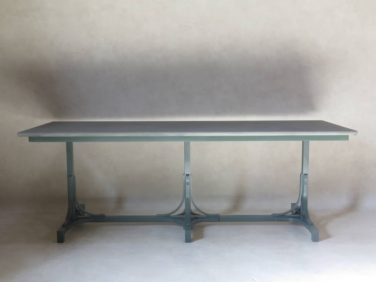 Chic painted iron table with a matte slate grey/green stone top with rounded edges. Nice quality; heavy and well-made.
