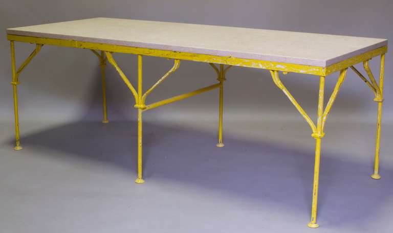 Lovely table with an elegant wrought-iron base in original yellow paint, and a thick marble top.

Seats six comfortably.