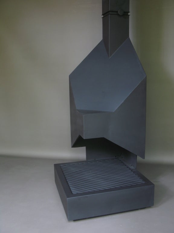 Striking one-of-a-kind fireplace of Cubist design. Sheet metal, painted a matte black. Tray or grill in the bottom section slots into place and is easily removed to clean. 

Clean, bold and graphic design.

Dimensions provided below do not